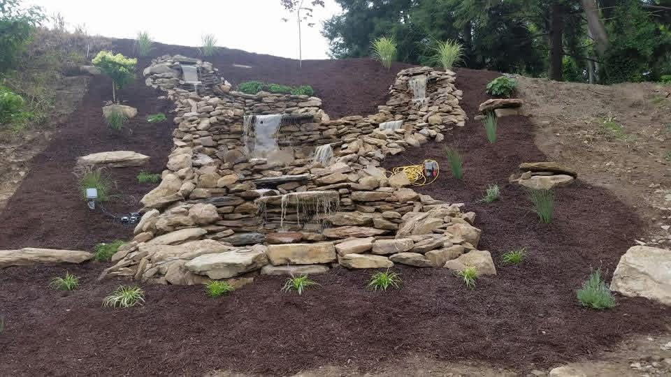 Stacked stone retaining wall